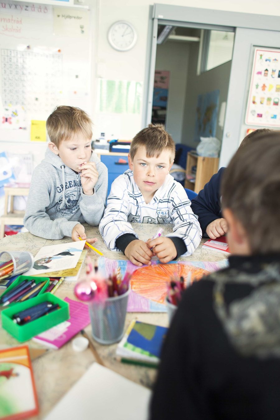 Pupils drawing together in class