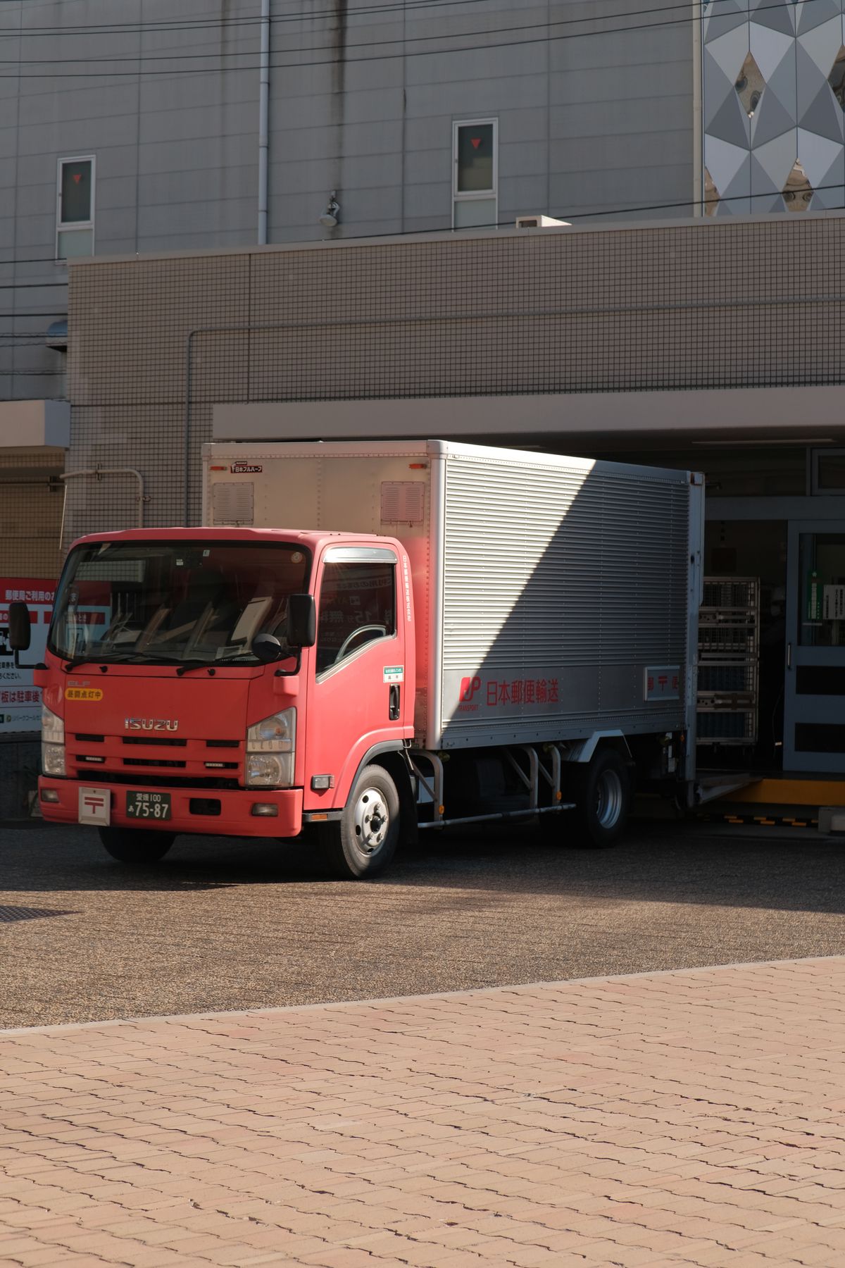 A column tail lift fitted to the rear of a commercial vehicle