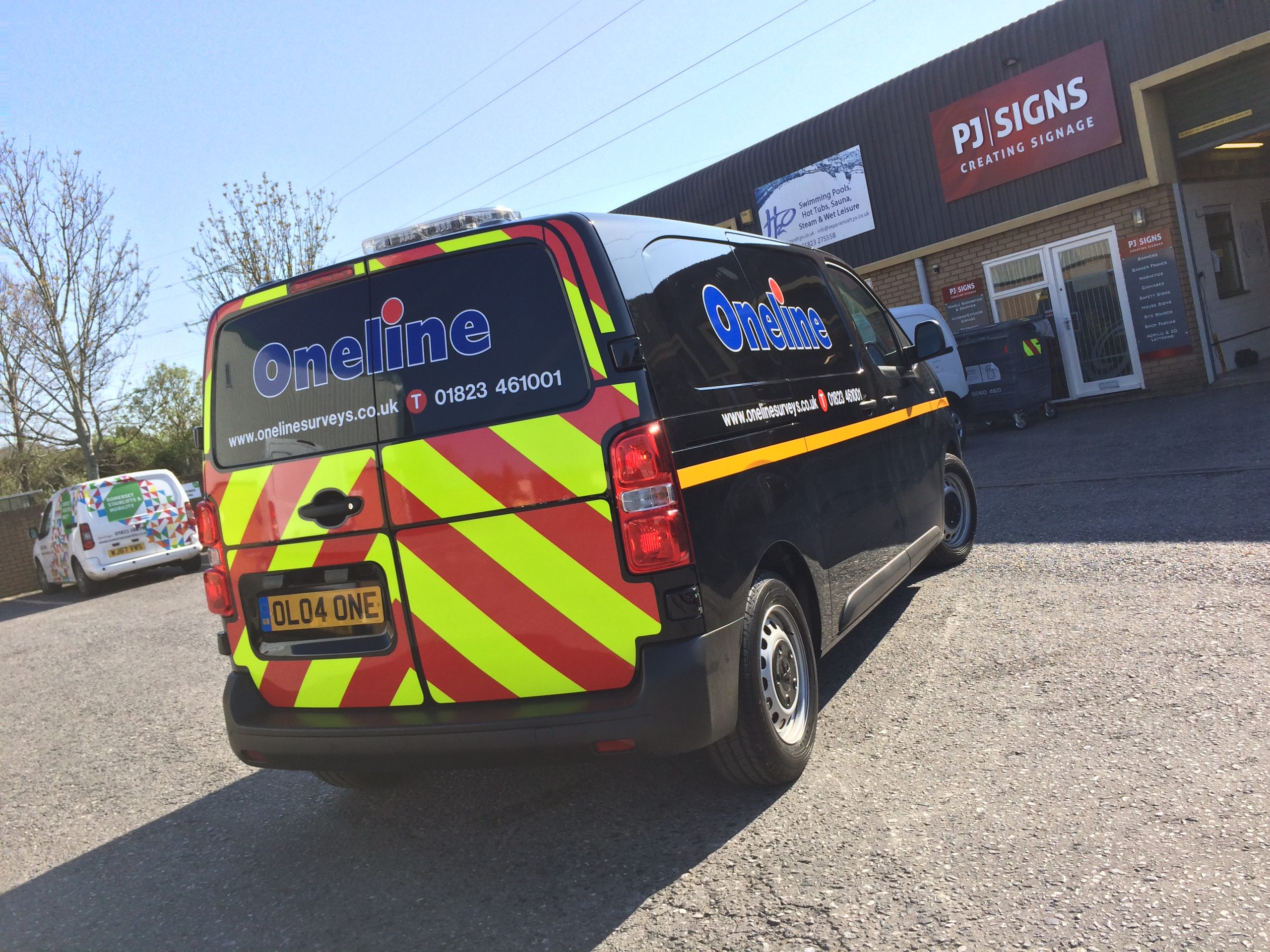 A van wrapped by PJ Signs outside the PJ Signs workshop in Taunton