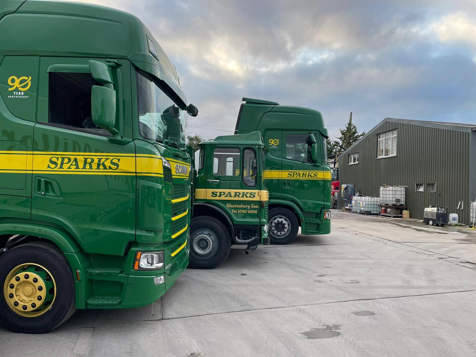 Sparks trucks carrying the 90-year anniversary mark on their cabs