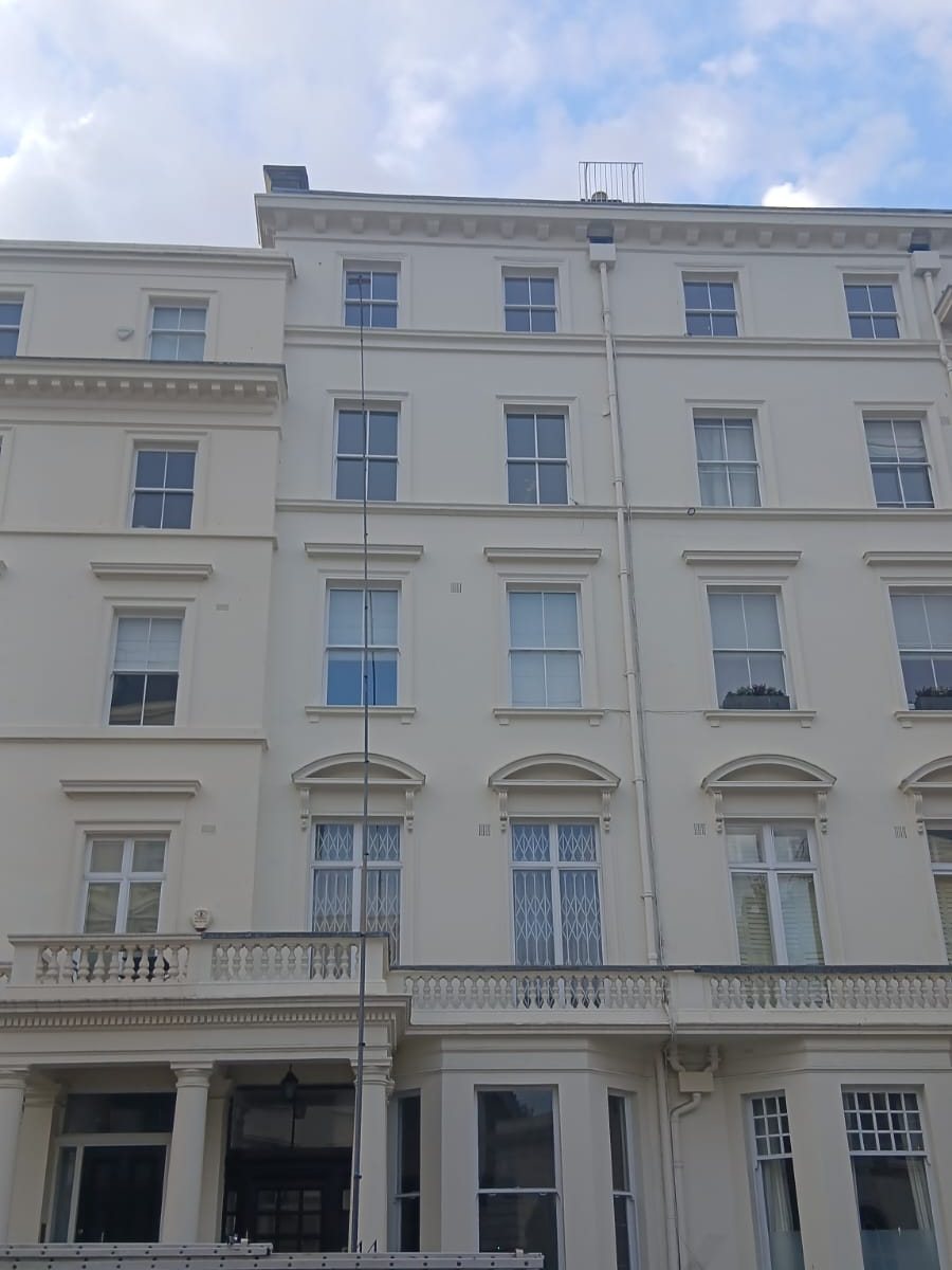 A reach and wash pole up a Central London terrace