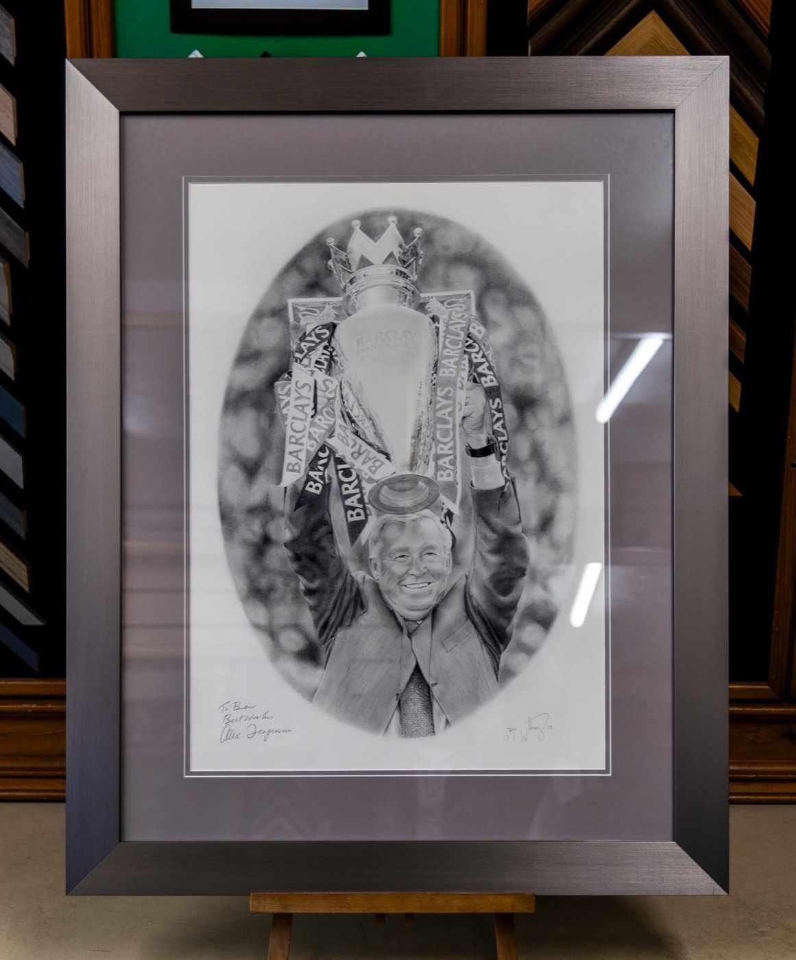 A signed pencil drawing, double mounted and framed in brushed pewter